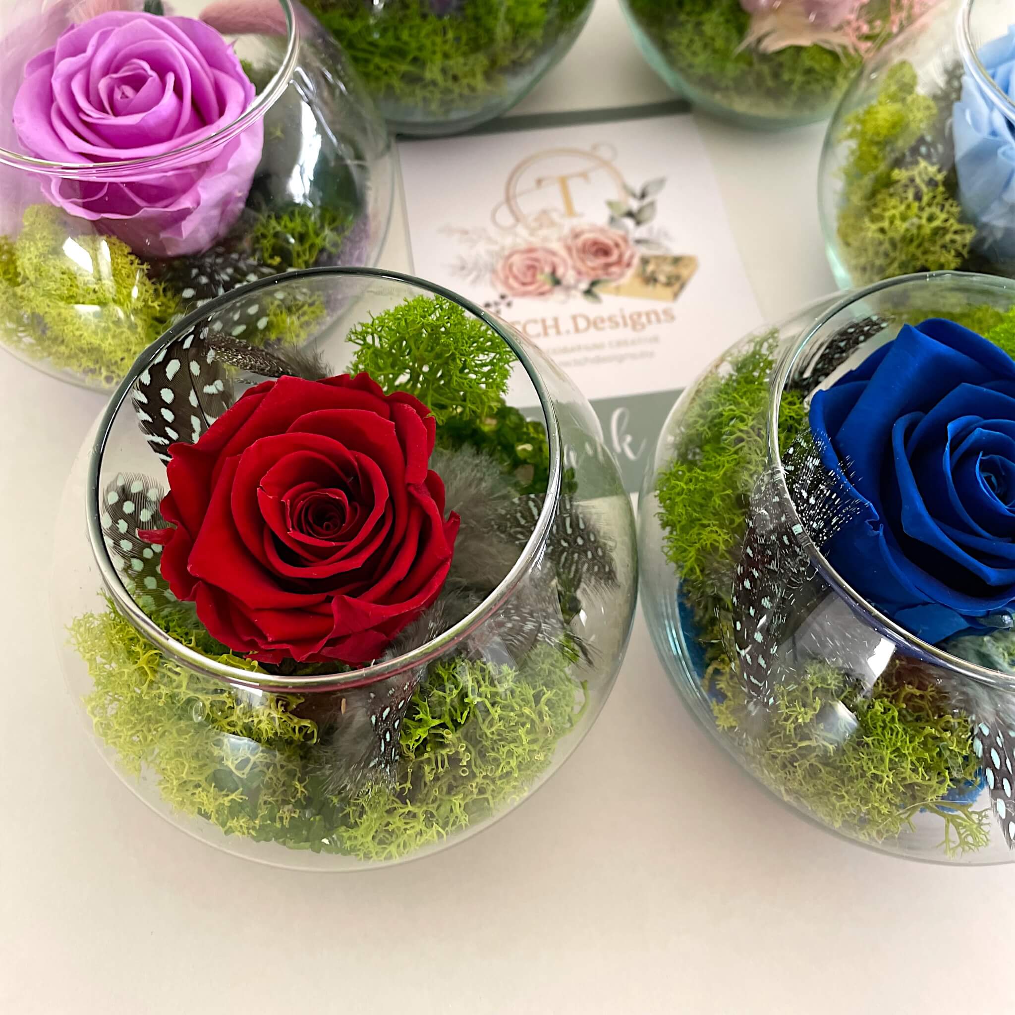Dark blue, pink and red rose arrangements