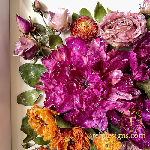 Close-up of vibrant flowers with a brand logo in the corner