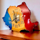 Blue, yellow, and red wall clock in the shape of Romania