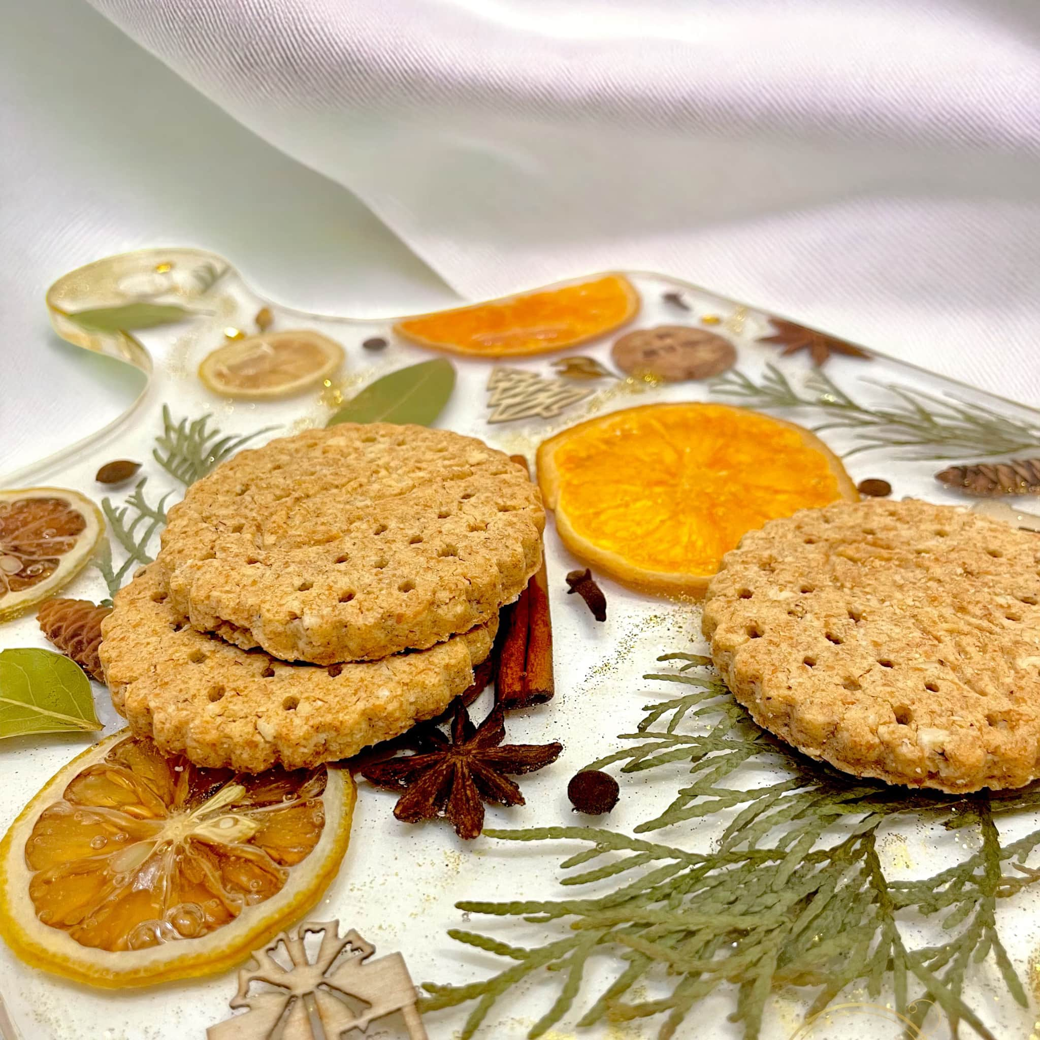 Cookies placed on the orange slices serving board