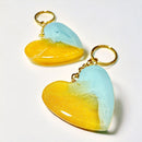 Two resin heart-shaped keychains