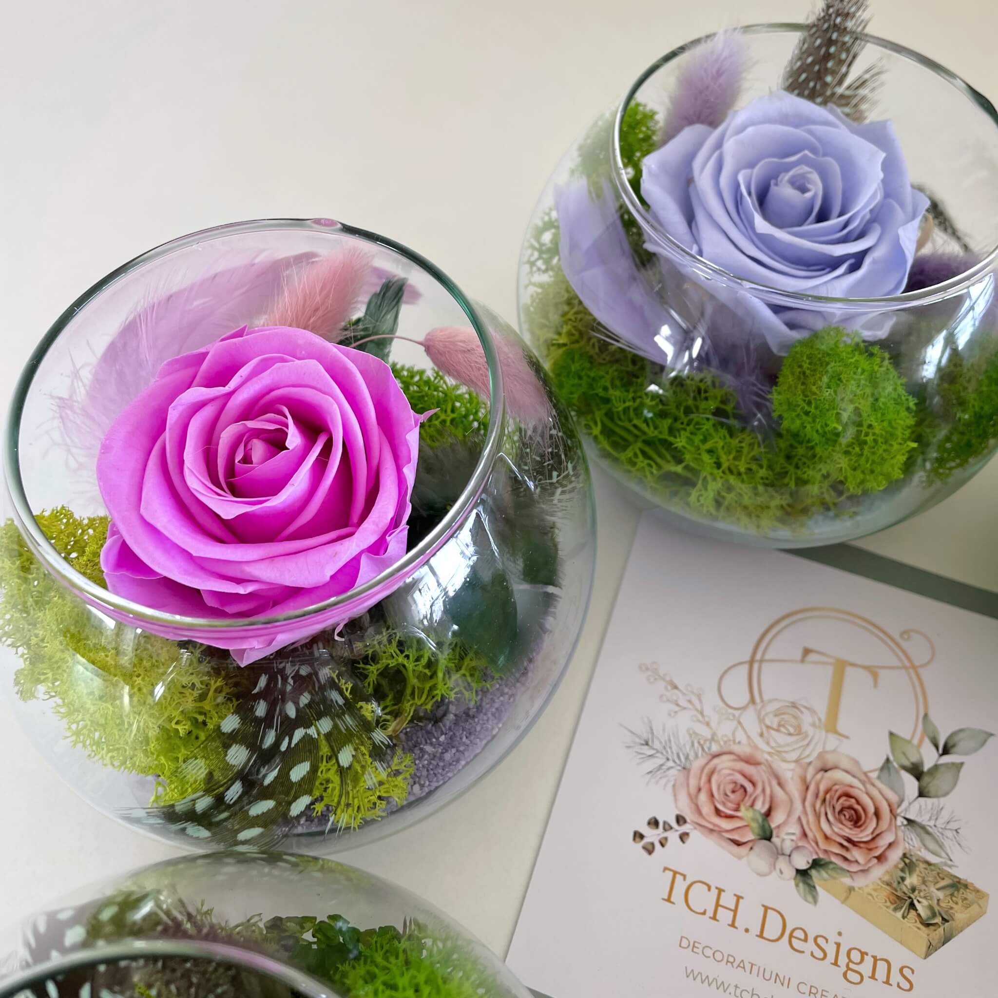 Pink and lavender preserved roses  in a round glass bowls