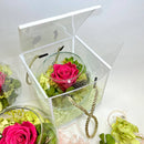 Rose in a round glass bowl inside gift box