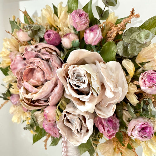 Close-up of preserved wedding flowers in resin