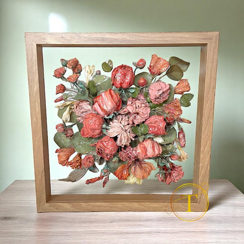 Shadowbox with transparent glass background and preserved wedding flowers