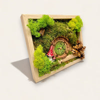 Side view of a Hobbit-inspired mossy scene with pine cones and mushrooms